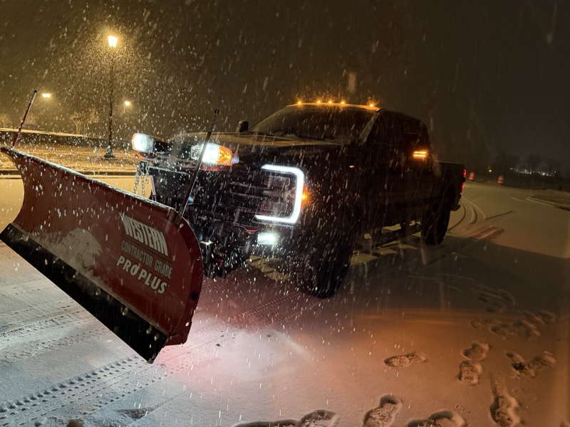 IronHaul truck with snow plow clearing roads during winter storm in Fredericksburg VA